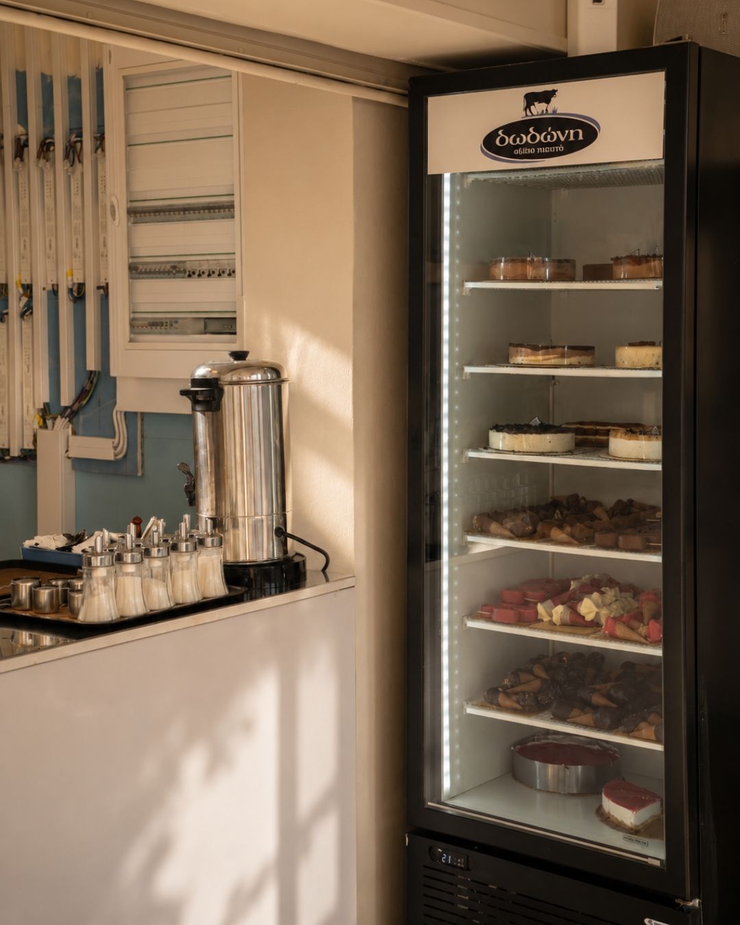 Display fridge with Dodoni cakes and gelato at Majestic Dodoni Cafe