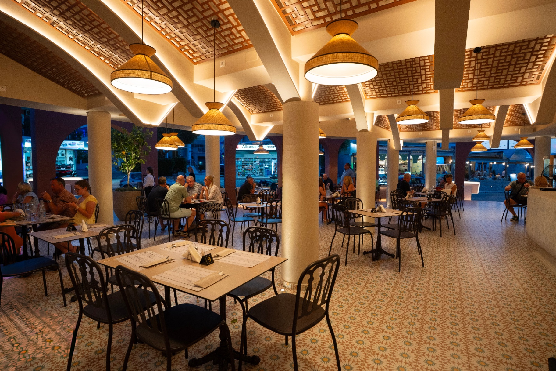 Majestic restaurant interior with woven pendant lighting